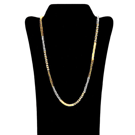 Necklace made of white, black, and gold colored seed beads on a black velvet display holder.