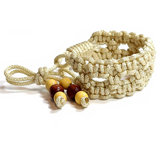 Macrame knotted bracelet/anklet with wooden bead tie ends.