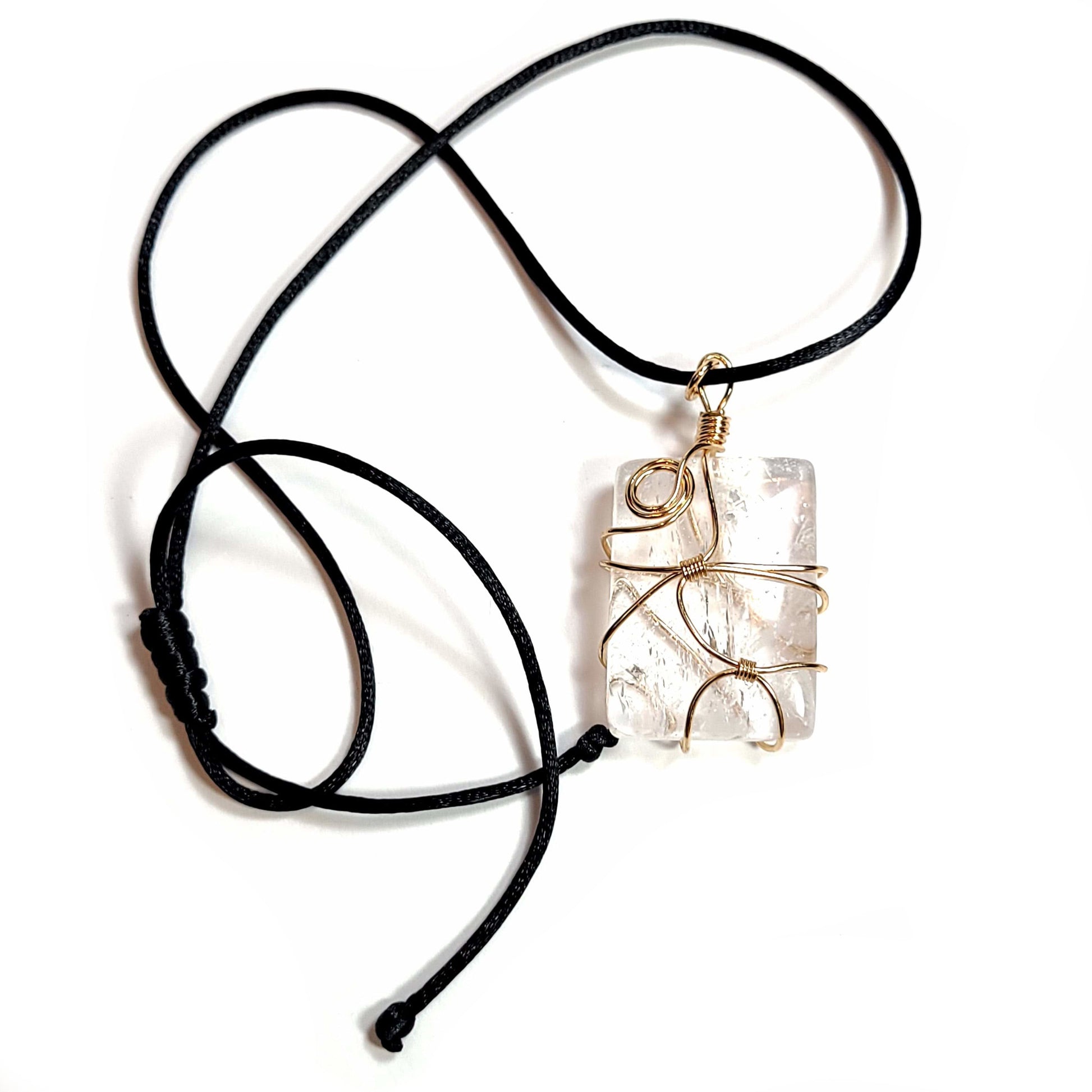 Rose gold colored wire wrapped Quartz Crystal with a black satin cord with an adjustable slip knot.