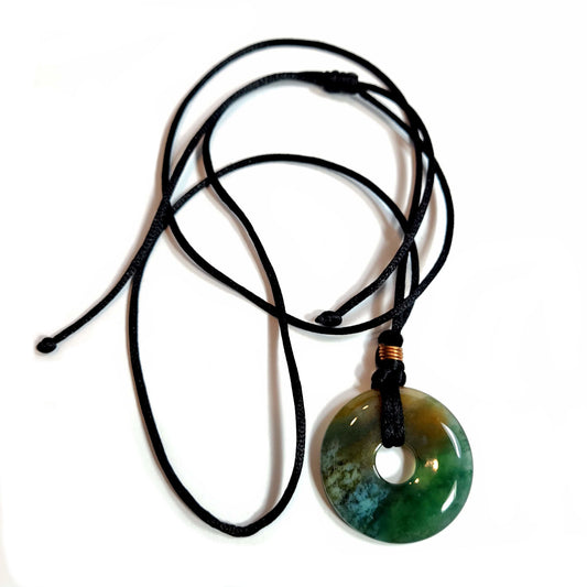 Doughnut shaped agate stone on a satiny black cord necklace