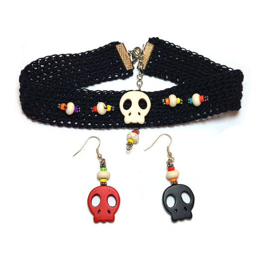 Black crocheted choker with white skull in center, flanked by decorative beads of blue, yellow, white, orange, and red, and silver spacers. A pair of earring with one skull each and decorative beads..