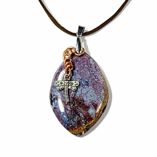 Beautiful Jasper stone pendant with dragonfly charm with a copper wire accent on a black cord necklace.