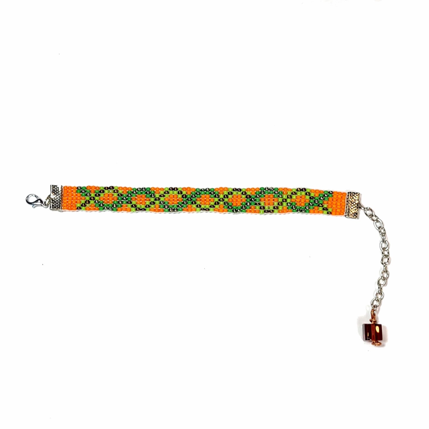 Full view of woven seed bead bracelet with orange, green, and black beads. Has a cute bead with copper wire accent on the extender.