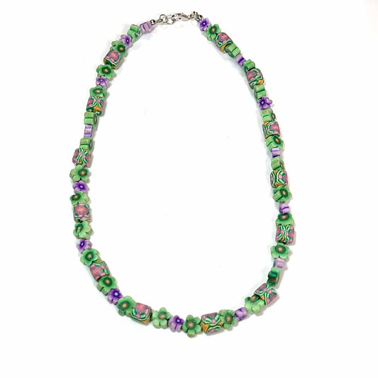 Green and purple floral polymer bead necklace.