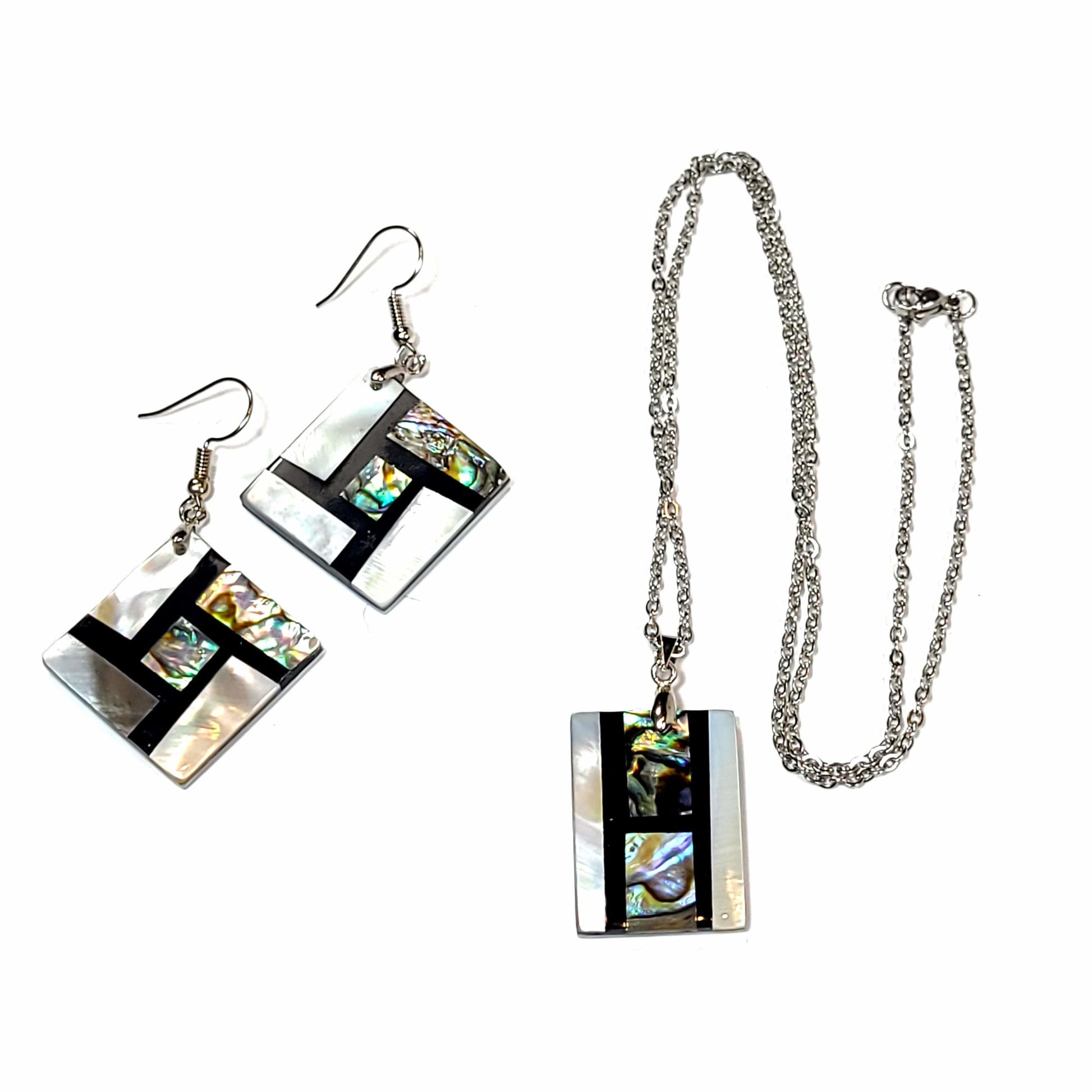 Necklace and earring set made of shell with black epoxy inlay.