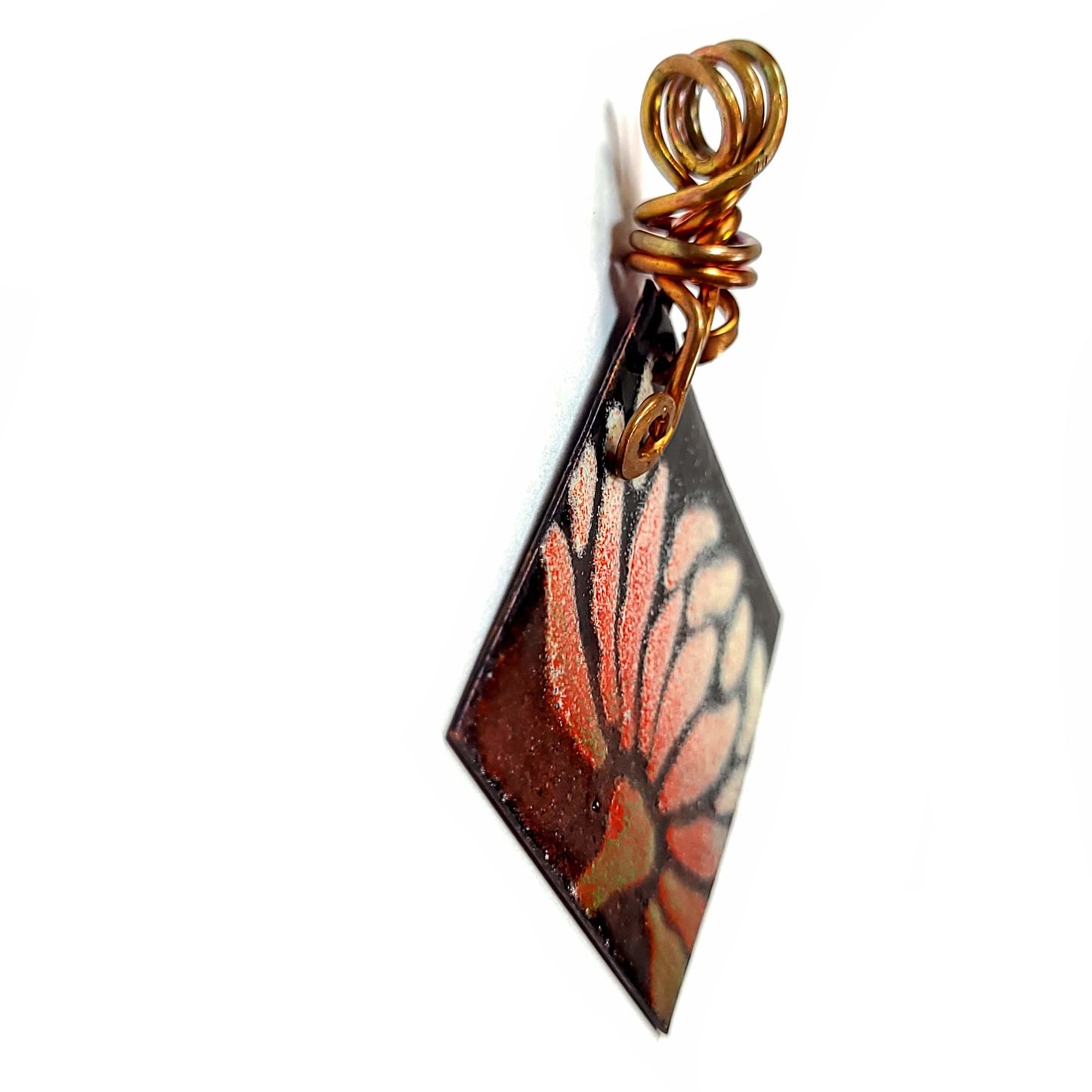 Side View of Flower Motiff on enamel pendant accented with copper wire.