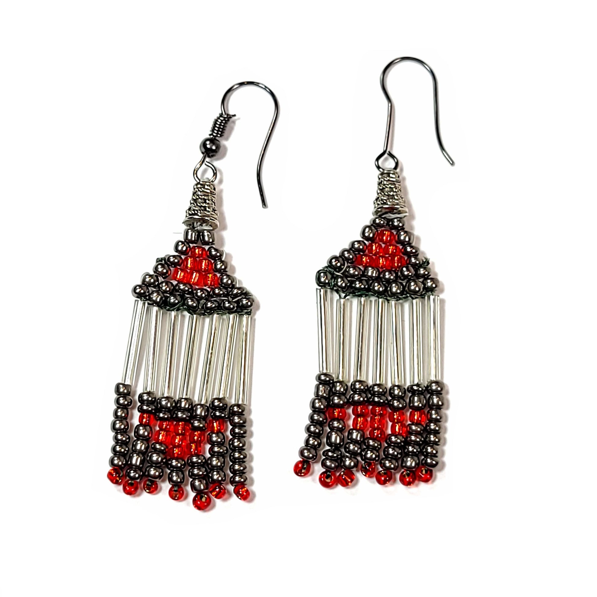 Earrings made with red, gray, and silver colored beads, shaped like a triangle at the top with what resembles fringe hanging from those triangles.