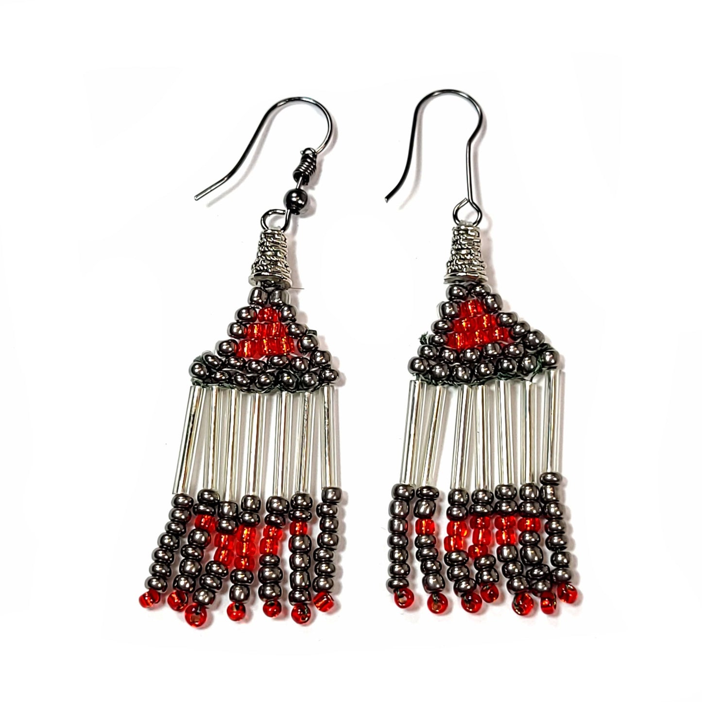 Earrings made with red, gray, and silver colored beads, shaped like a triangle at the top with what resembles fringe hanging from those triangles.