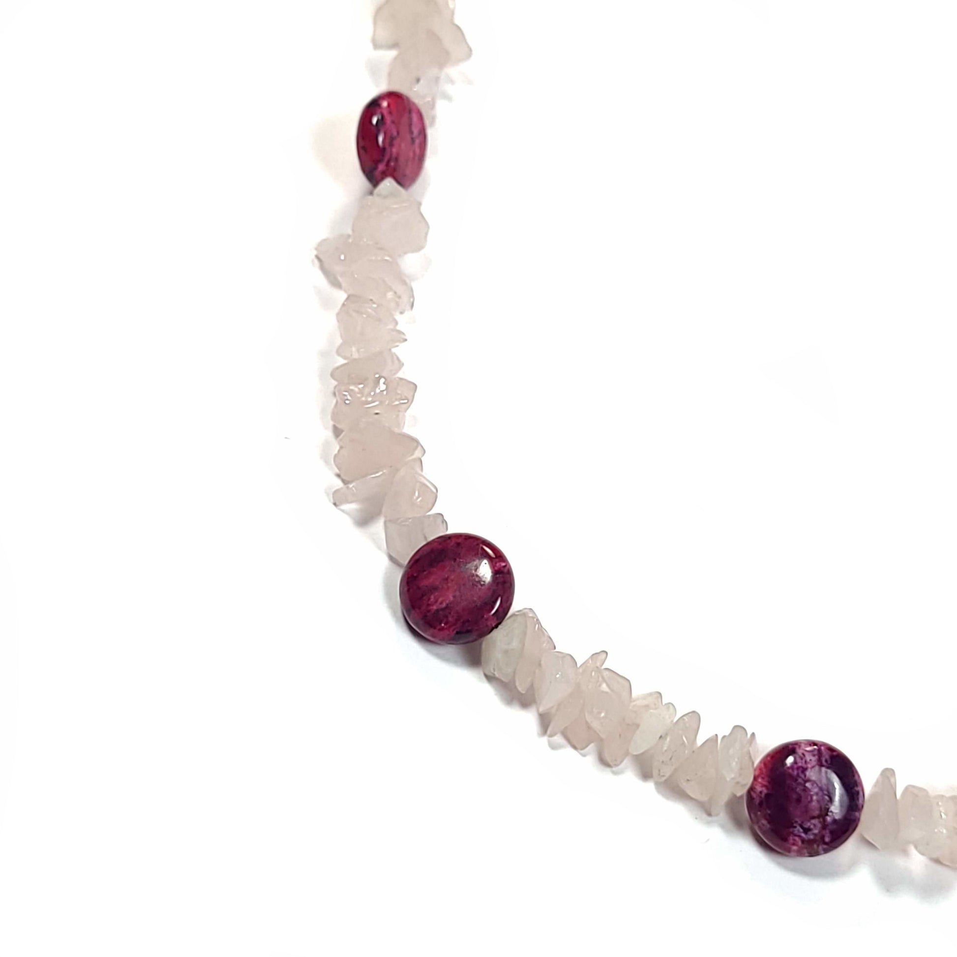 Necklace made of quartz chips and magenta agate disks with a silver toned lobster clasp and end beads.