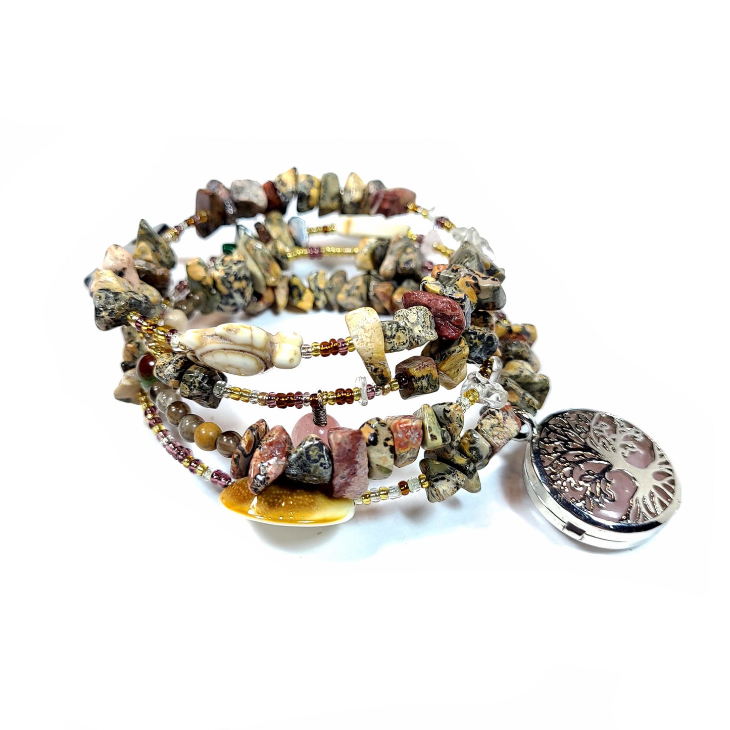 Memory wire bracelet made with multi-colored jasper chips, skull charm, quartz chips, seed beads, silver tone and semi precious stone charms.