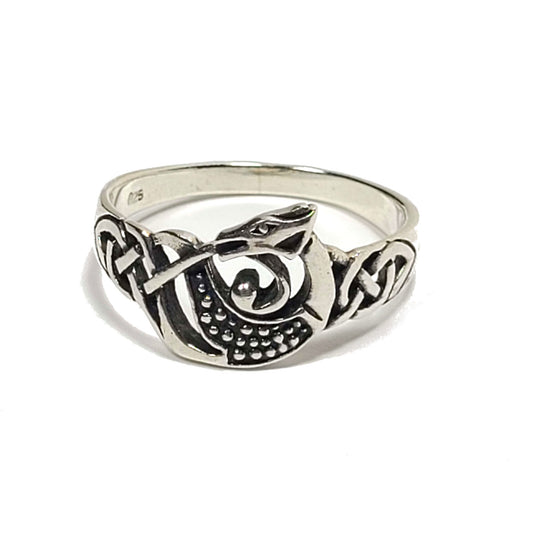 Silver ring with celtic style knot design with a dragon in the center. The dragon body has circular pieces that represent scales. The inside of the band is stamped with "925."